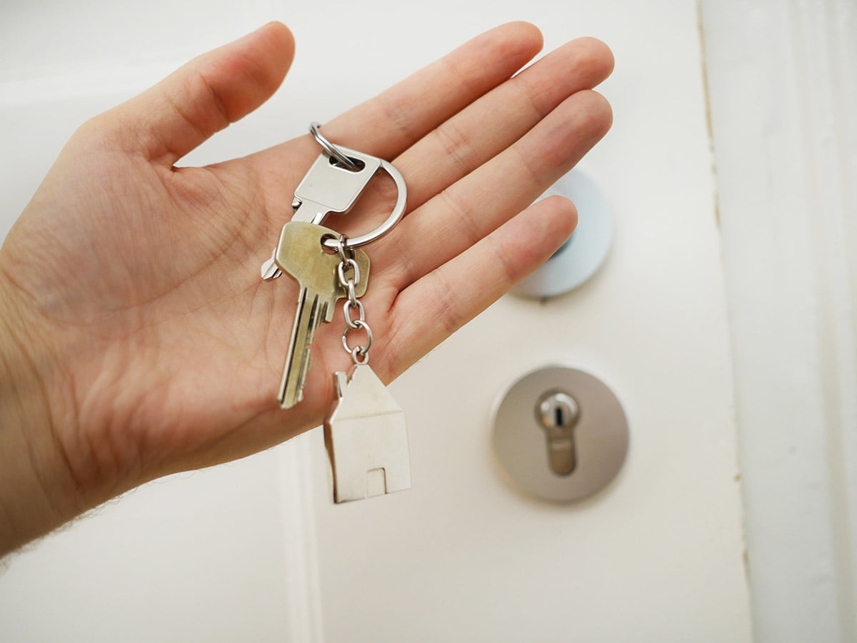 person with house keys to a new home
